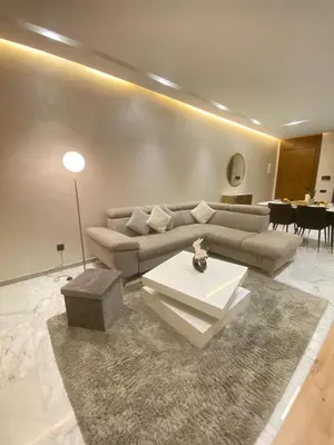a living room with a couch and a table at Appartement 2 ch in Marrakech
