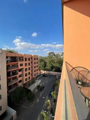 a view of a street from a balcony of a building at Appartement 2 ch in Marrakech