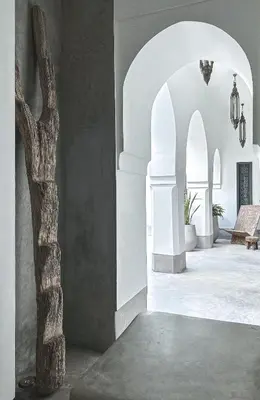a room with a tree in the middle of a building at Riad Atay in Marrakech