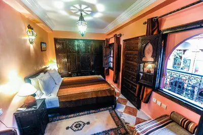 a room with a bedroom with a bed and a window at Riad Errabii & Spa in Marrakech
