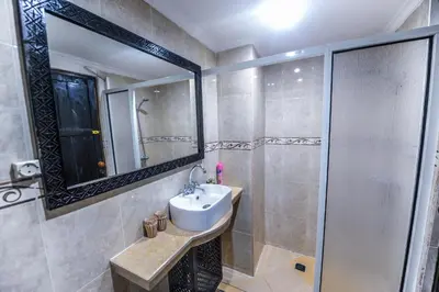 a bathroom with a sink and a shower at Riad Errabii & Spa in Marrakech