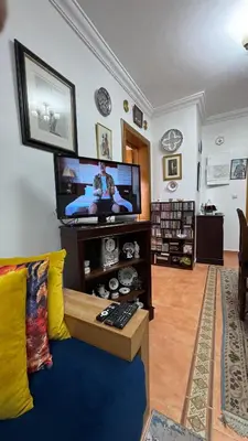 a living room with a couch and a flat screen tv at شقة الفن Art Apartment in Marrakech