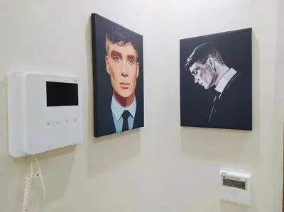 two pictures of a man in a suit on a wall at Chic & Lovely Flat in City Center in Marrakech