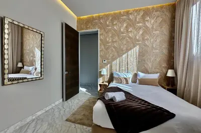 a bedroom with a large bed with a large mirror at Luxury living/Terrace/Pool in Marrakech