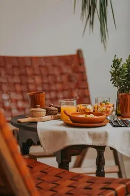 a table with plates of food and drinks on it at Riad Babel au coeur de la Médina in Marrakech