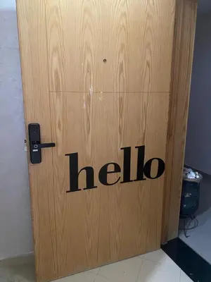 a wooden door with the word help on it at Luxury apart à Gueliz Marrakech in Marrakech