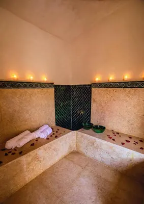 a bathroom with a bath tub with lights on it at Riad Zazz in Marrakech