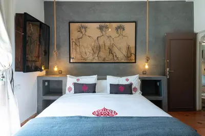 a bedroom with a large bed with a blue blanket at Private Villa Comfort & Relax-Heated Pool in Marrakech