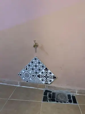 a kite sitting on the corner of a wall at Medina House in Marrakech