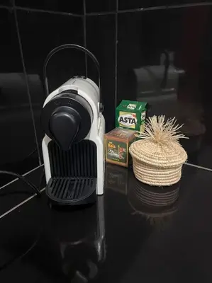 a coffee maker is sitting on a table at Medina House in Marrakech