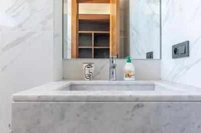 a bathroom with a sink and a mirror at Villa Saadia in Douar Bellouk