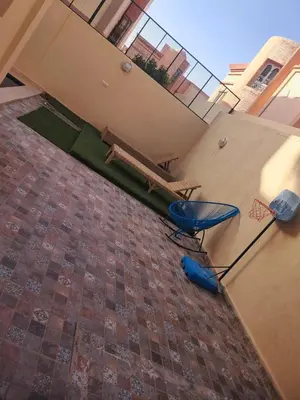 an aerial view of a basketball hoop on a brick floor at Villa Al Nour avec piscine in Marrakech
