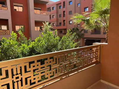 a balcony with a view of some buildings at Cosy luxe RB Marrakech in Marrakech