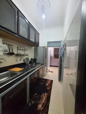 a kitchen with a sink and a stove at Marrakech plus in Marrakech