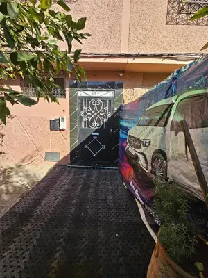 a van parked in front of a door with graffiti at Marrakech plus in Marrakech