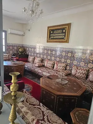 a living room with a couch and a table at Marrakech plus in Marrakech
