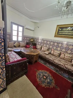 a living room with a couch and a table at Marrakech plus in Marrakech