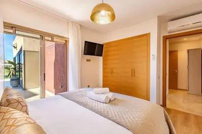 a bedroom with a bed with two towels on it at Prestigia Saphir,Piscine, Jardin in Marrakech