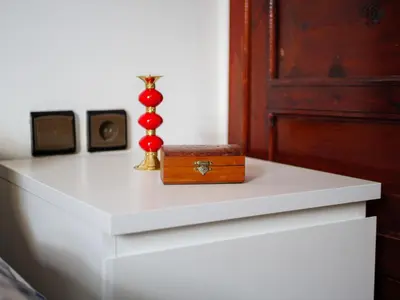 a wooden box sitting on top of a white table at Family Illuminated Apartment With Pool in Marrakech