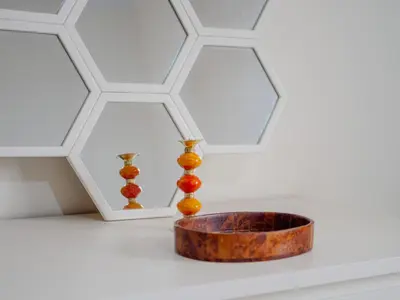 a bowl and two vases on a table with a ceiling at Family Illuminated Apartment With Pool in Marrakech