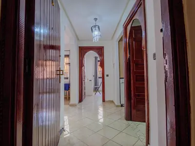 a hallway of a home with a door and a hallwayngth at Family Illuminated Apartment With Pool in Marrakech