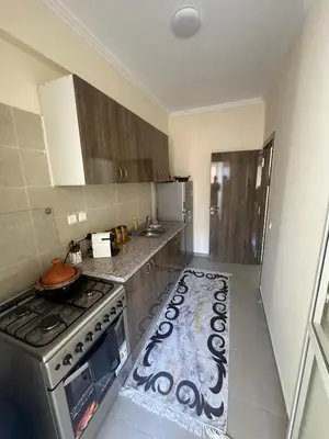 a kitchen with a stove and a counter top at Marrakech airport apartment in Marrakech