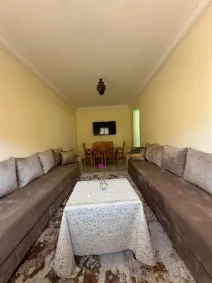 a living room with a couch and a coffee table at Marrakech airport apartment in Marrakech