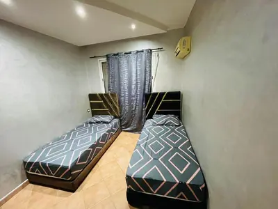 a bedroom with two beds in a room at Big Gardens 3 in Marrakech