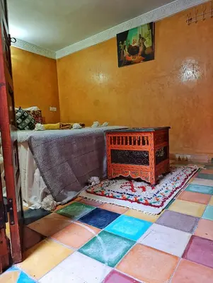 a room with a couch and a rug on the floor at Medina house in Marrakech