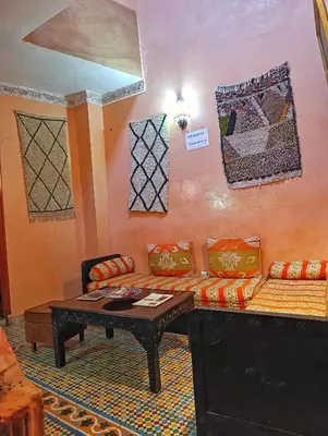a living room with a couch and a coffee table at Medina house in Marrakech