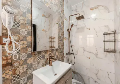a bathroom with a sink and a shower at 16 Riads in Marrakech
