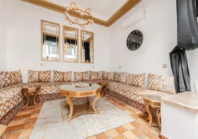 a living room with a couch and a table at 16 Riads in Marrakech