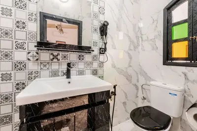 a bathroom with a sink and a toilet at 16 Riads in Marrakech