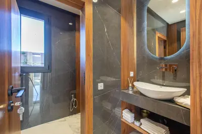 a bathroom with a sink and a mirror at Villa Rafinity Marrakech in Marrakech