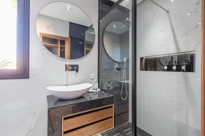a bathroom with a sink and a mirror at Villa Rafinity Marrakech in Marrakech