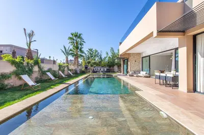 a swimming pool in the backyard of a house at Palais Rafi in Marrakech