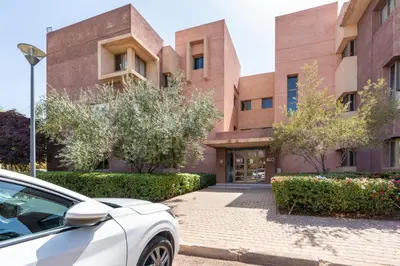 a white car parked in front of a building at Exceptional Style Nonstop Luxury in Marrakech