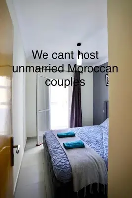 a bedroom with a bed with two towels on it at Comfy family flat 10 mins from Medina in Marrakech