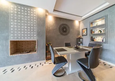 a dining room with a table and chairs and a fireplace at Relaxing Summer-Pool-Garden-Wifi in Marrakech
