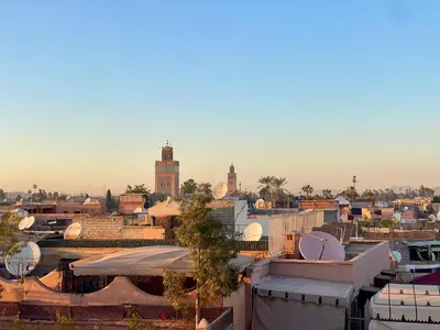 a view of a city with buildings and mosques at Riad Wadiya, privatif, piscine en rooftop. in Marrakech