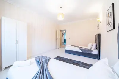 a bedroom with two beds in a room at Central appartement in the heart of Guéliz in Marrakech