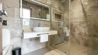a bathroom with a sink and a shower at Villa KOEUR, piscine chauffée sans vis-à-vis à Marrakech in Marrakech