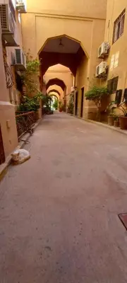 an empty alley way in a building with an archway at Riad Nour Resorts in Marrakech