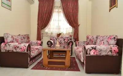 a living room with two couches and a table at Cheap accommodation in Marrakech in Marrakech