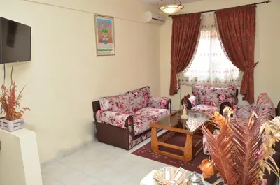 a living room with two couches and a table at Cheap accommodation in Marrakech in Marrakech