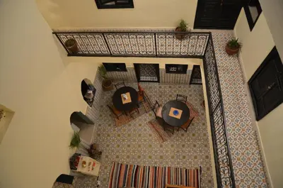 an overhead view of a living room with a table and chairs at Dar Mirai in Marrakech