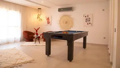a ping pong table in a living room at Loft Atlas in Marrakech