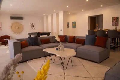 a living room with a couch and a table at Loft Atlas in Marrakech