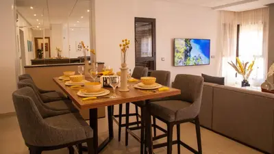 a dining room with a table and chairs at Loft Atlas in Marrakech
