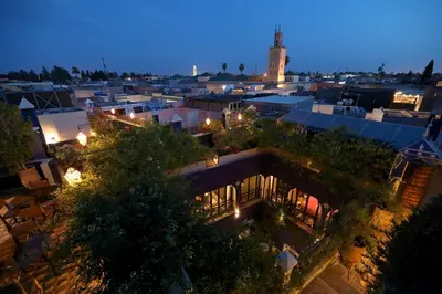 an overhead view of a city at night at Riad Bindoo & Spa in Marrakech
